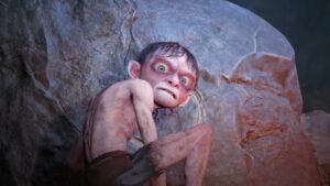 Gollum, from the game of the same name, a pale, bony, vaguely humanoid creature with big eyes, wearing tattered trousers. He is glaring over his shoulder at the viewer while etching the symbol of a ring into a rock.