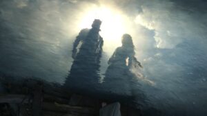 Aerial shot of Sauron and Galadriel's reflections in clear water, silhouetted against the pale sun. Sauron is taller, wearing armor and a crown. Galadriel's hair is unbound, and she wears a white long-sleeved gown. Their faces are shadowy.