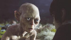 Close-up image of Gollum, a gaunt, pale, wide-eyed bald creature.