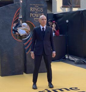 Luca Mosca at the premiere for The Lord Of The Rings: The Rings Of Power. He is wearing a black suit and tie.